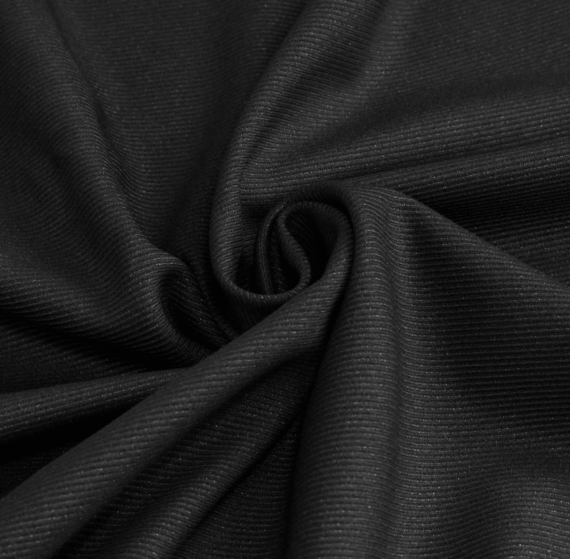 Close-up of soft, textured black fabric ideal for gothic front zip pants with lace details.