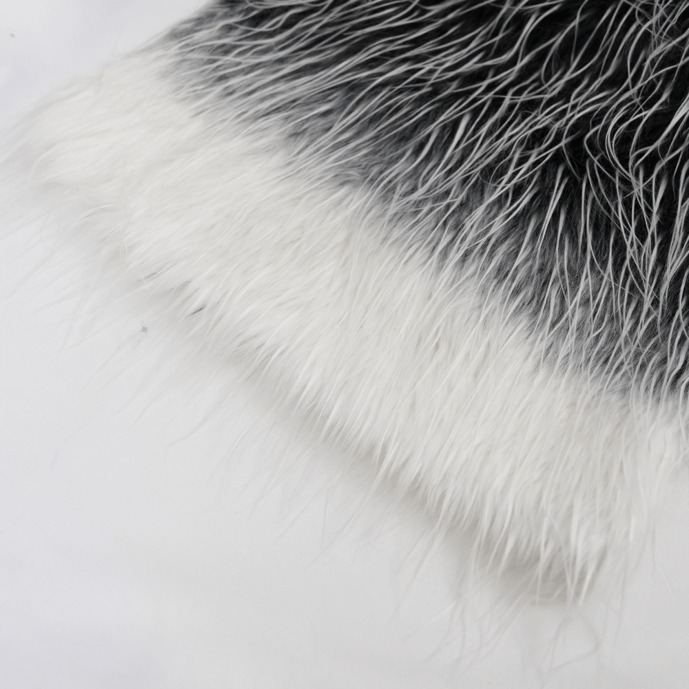 Black and white faux fur detail of Gothic leg warmers with a punk style.