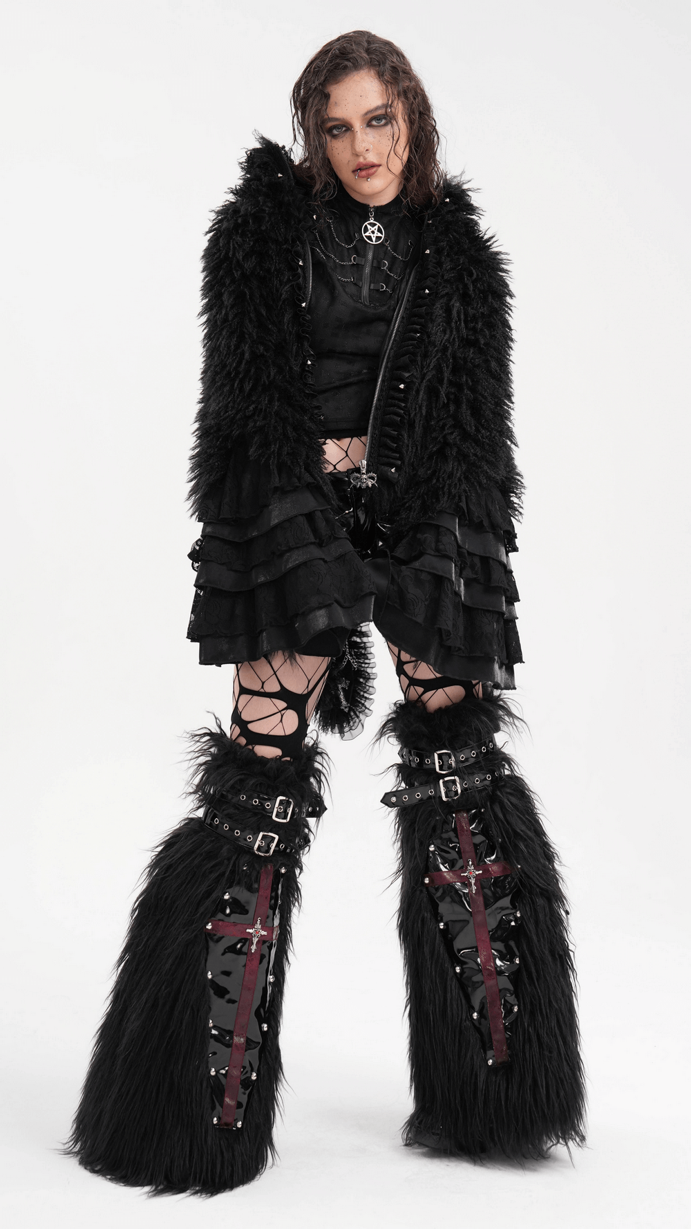 Gothic punk outfit with black furry leg warmers featuring red cross straps, metal studs, and buckles for alternative style.