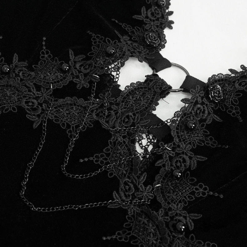 Close-up of intricate lace details and chains on gothic velvet dress, showcasing seductive neckline and stylish embellishments.