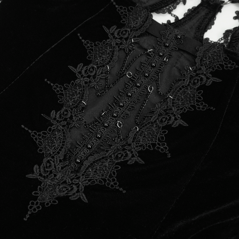 Intricate lace detailing on a gothic velvet dress featuring a sexy neckline and luxurious black fabric.