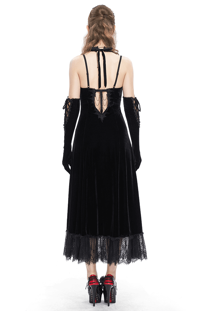 Back view of a gothic velvet dress with shoulder ties and lace hem, perfect for a seductive, dark aesthetic.