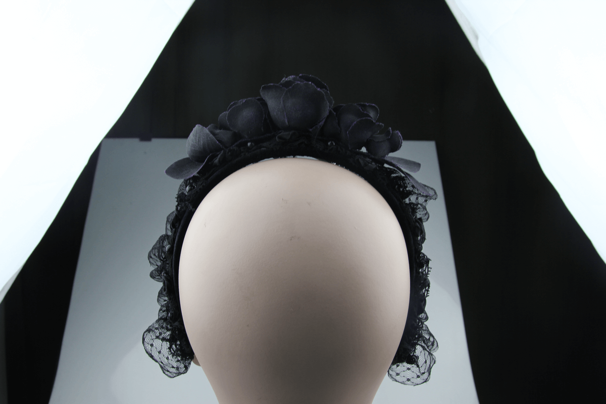 Elegant women's black floral hair wreath with rose accents, perfect gothic accessory for any outfit.