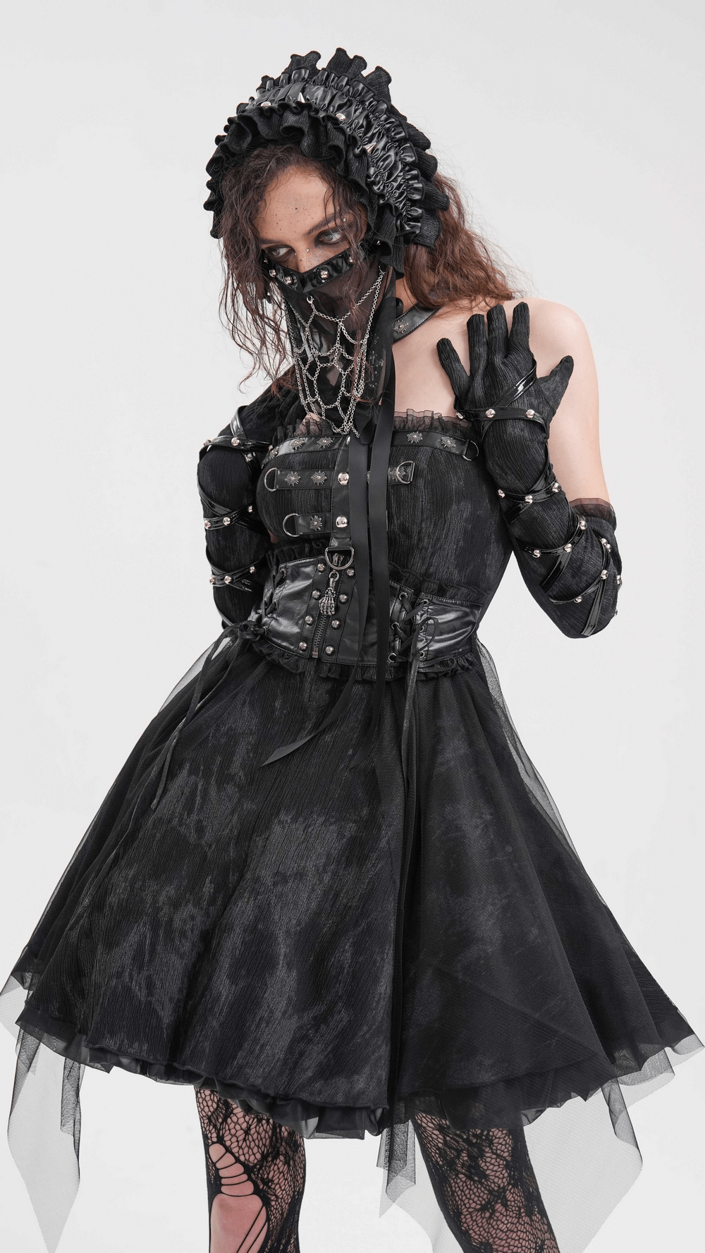 Victorian-inspired gothic outfit with ruffled headpiece, black dress, and lace gloves for cosplay or themed events.