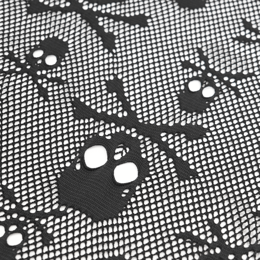 Close-up of skull-patterned lace fabric with crossbones, perfect for gothic and punk fashion ensembles.