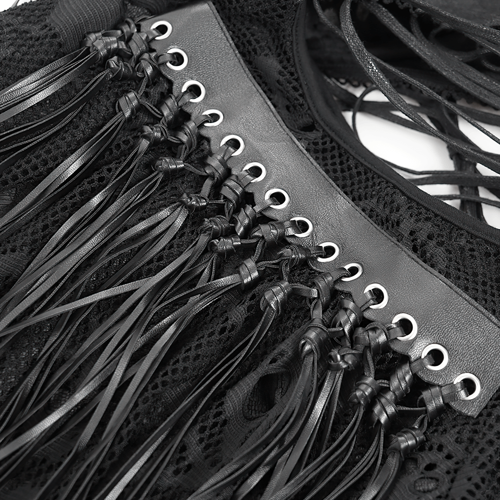 Close-up of lace-up details and fringe paneling on a gothic halter dress, showcasing edgy design and texture.