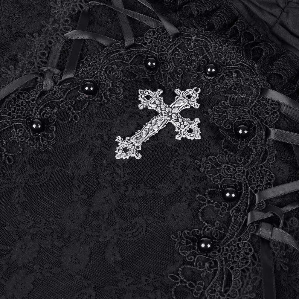 Intricate black lace with ribbon details and a silver cross embellishment for gothic fashion.