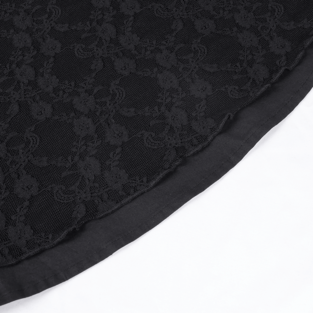 Close-up of black lace fabric with floral patterns, perfect for gothic and elegant fashion designs.