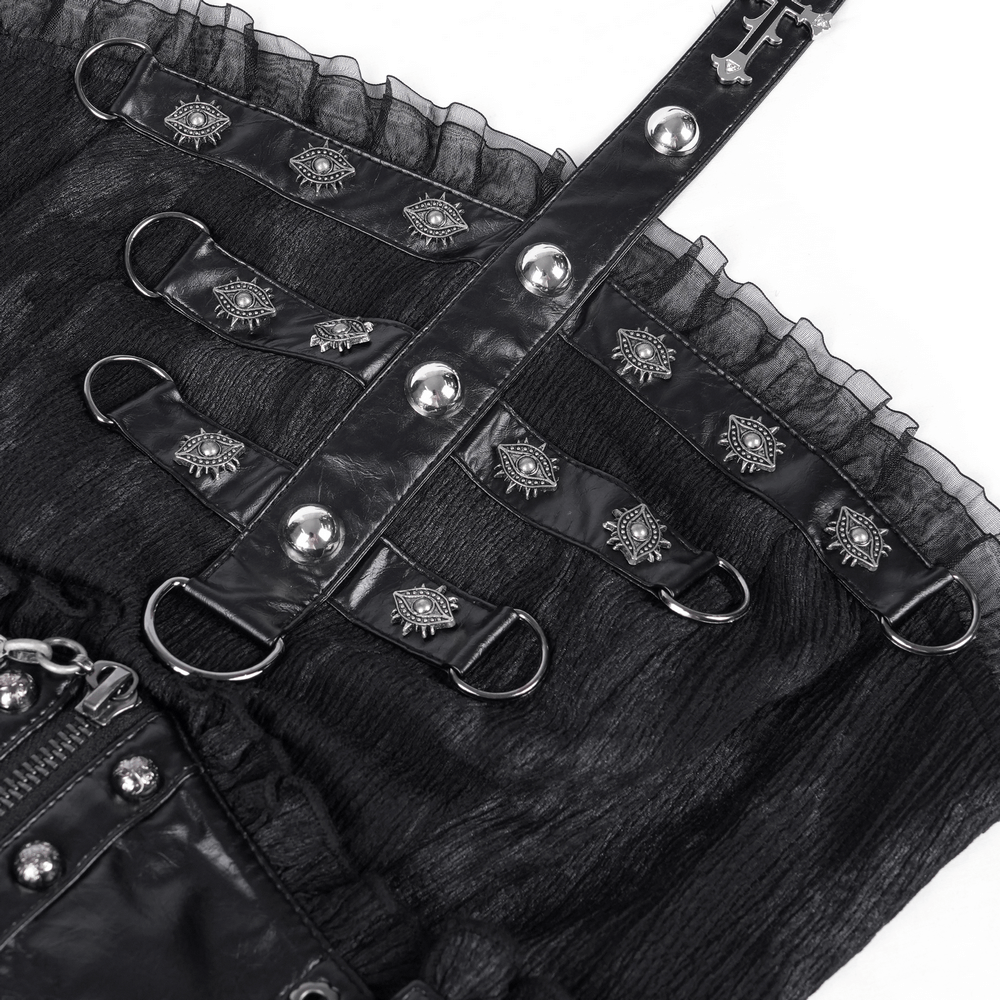 Close-up of gothic mini dress featuring leather straps, mesh layers, and intricate silver detailing.