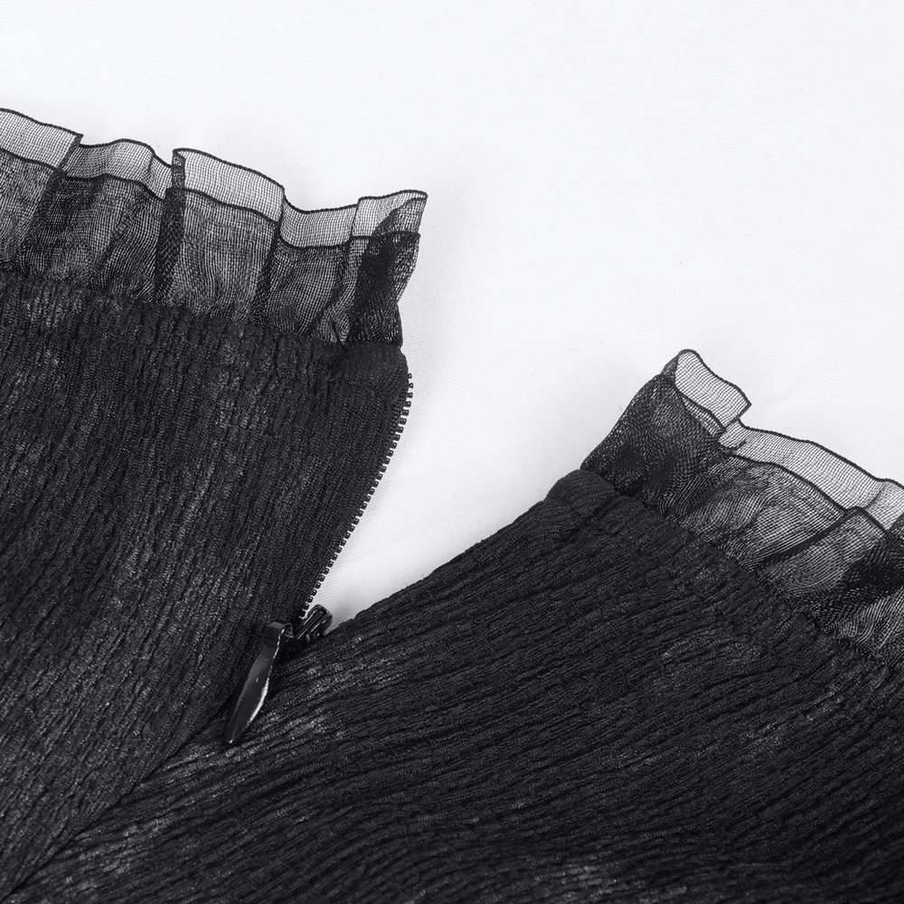 Close-up of the ruffled mesh neckline and zipper detail of a gothic mini dress, showcasing edgy elegance.