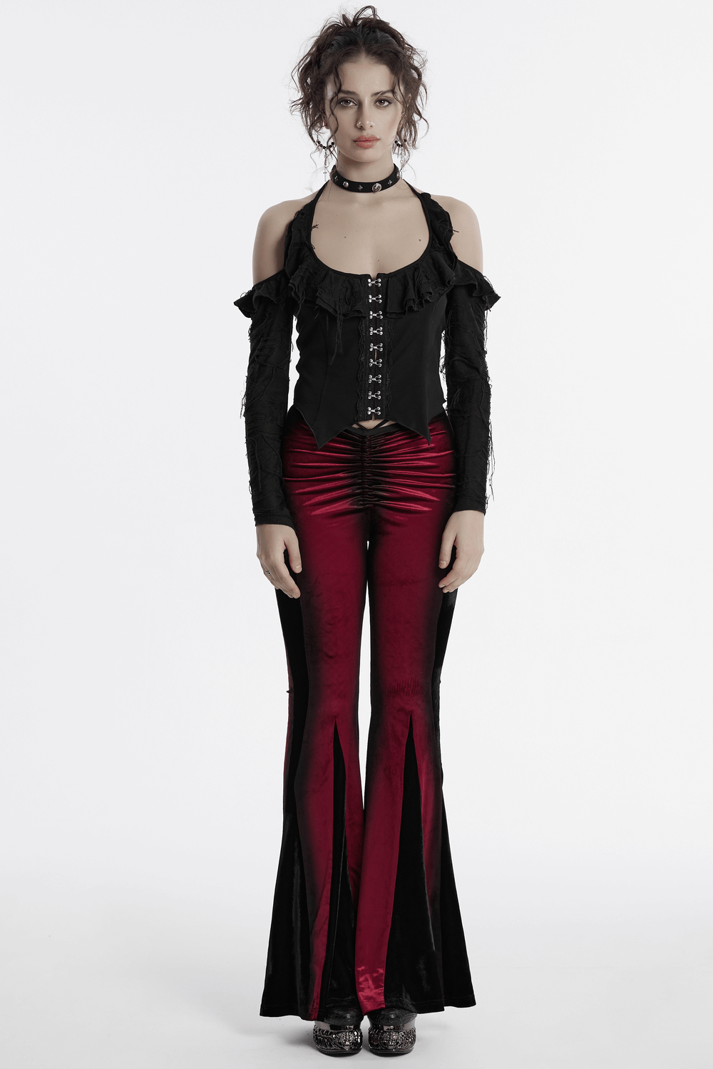 Gothic halter top with ruffles and detachable sleeves, paired with dramatic red bell-bottom pants.