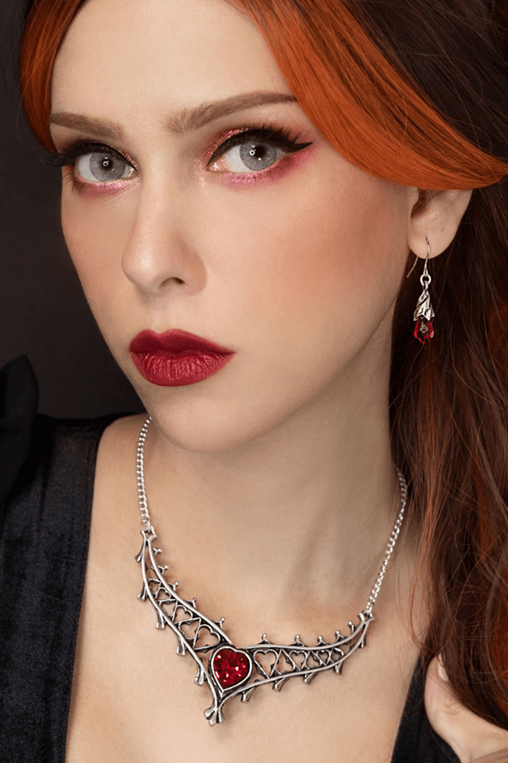 Gothic Heart Crystal Necklace With Ornate Tudor Design worn by a model showcasing its dramatic elegance.