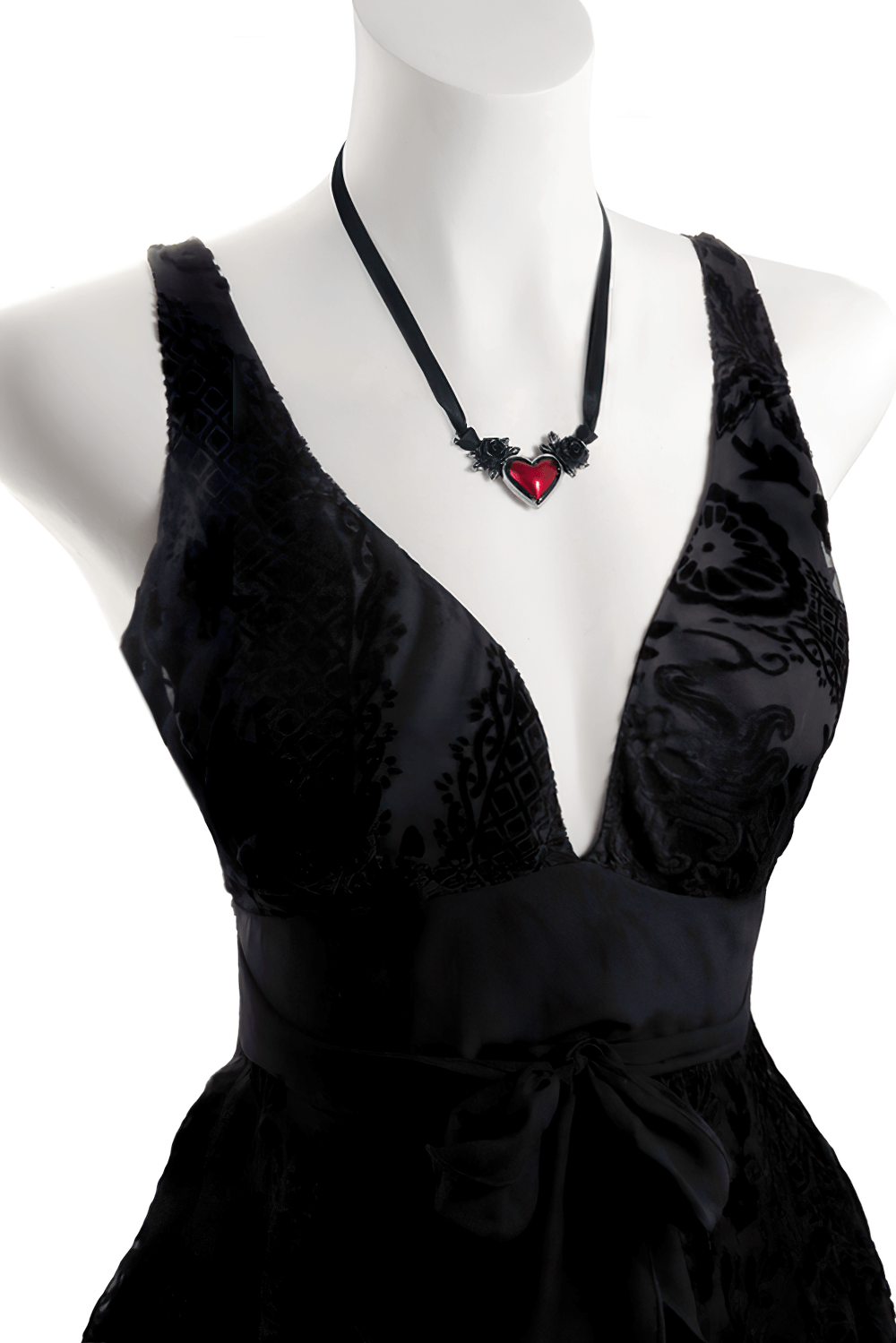 Gothic heart necklace with black roses and blood red center worn on a black dress with a plunging neckline.