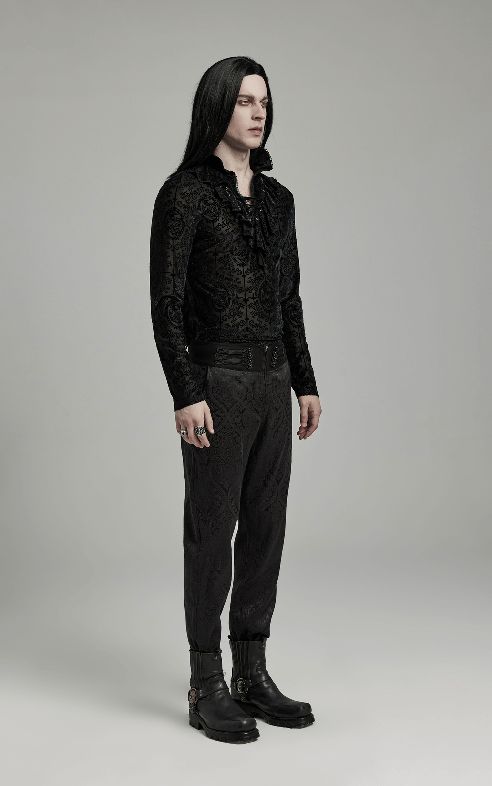 Men's Gothic high collar lace-trim velvet top showcased with stylish black pants and boots against a minimalist backdrop.