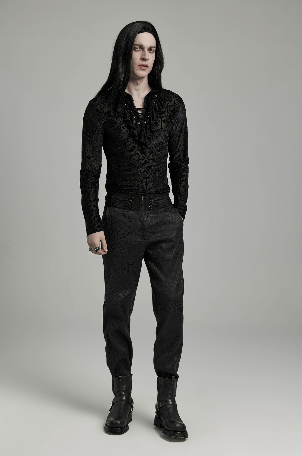 Gothic high collar velvet top with lace trim, modeled by a man in a dark ensemble, exuding a mysterious vibe.