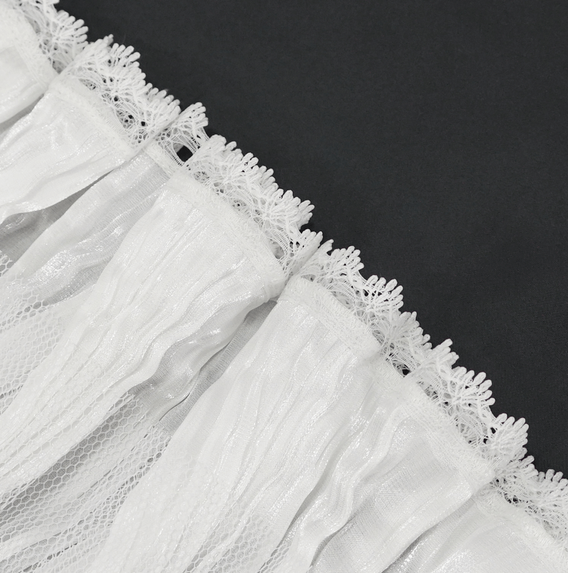Close-up of white lace ruffle with delicate trim, perfect for gothic or punk fashion styles.