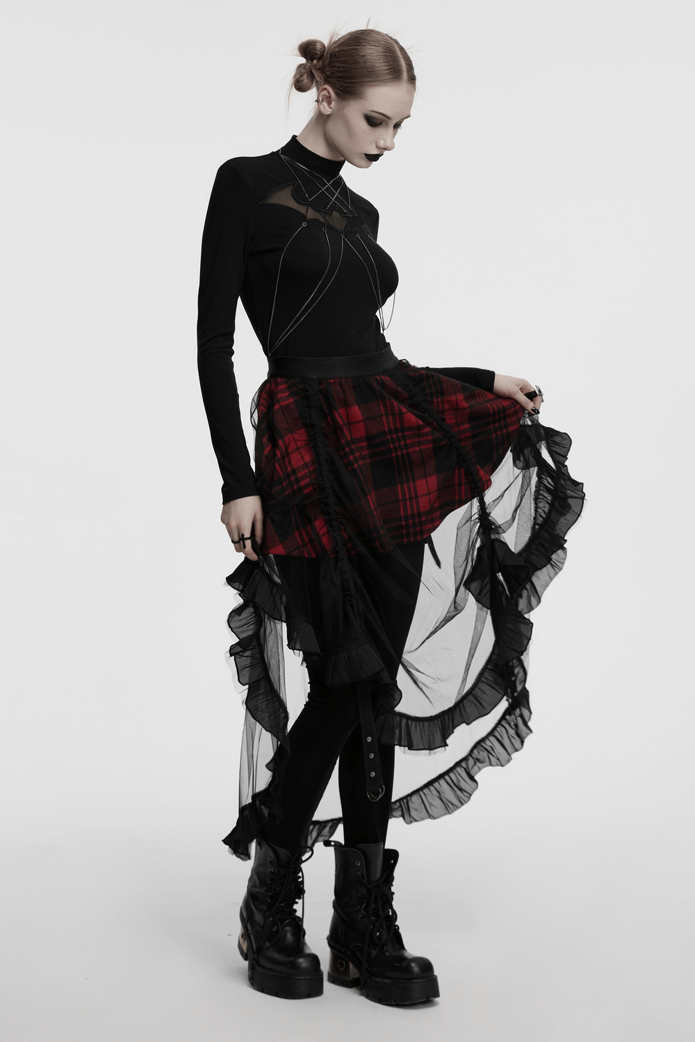 Gothic high-low tulle skirt with red plaid design, paired with a sleek black top and combat boots.