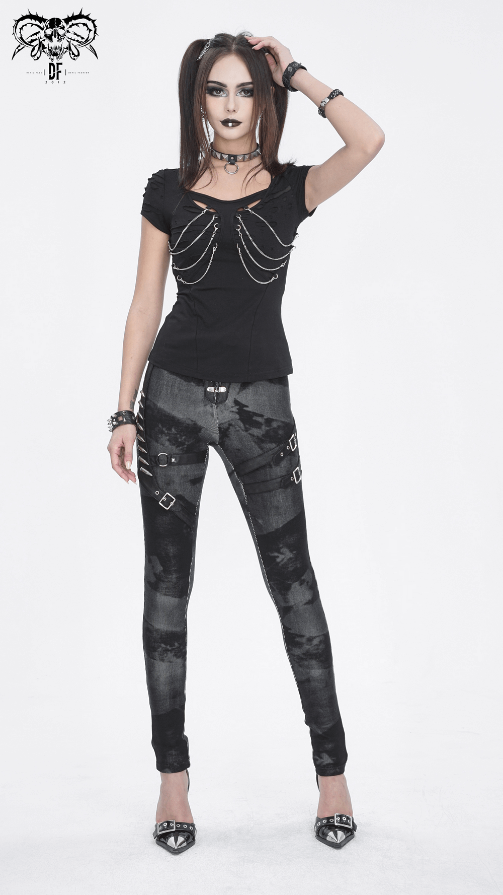Gothic high-waist lace-up skinny pants with edgy buckles and straps, paired with a stylish black top and statement accessories.