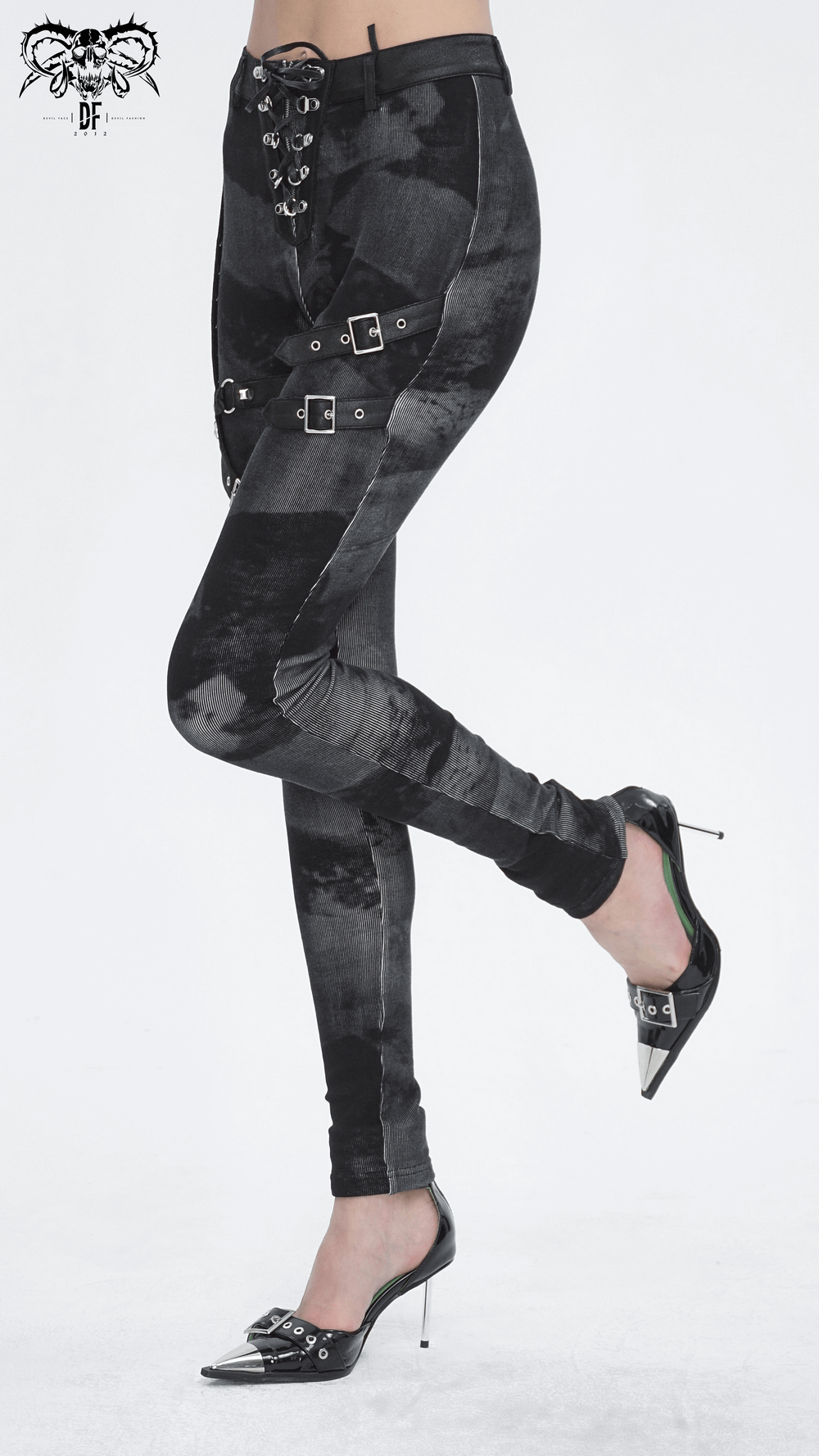 Gothic high-waist lace-up skinny pants with buckles and edgy hardware details, styled with sleek heels.