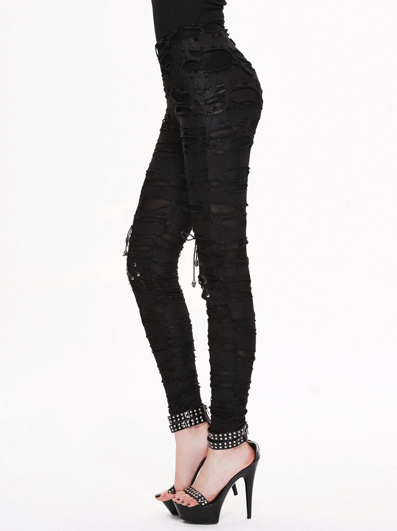 Stylish gothic high waist black pants for women with torn inserts, perfect for a bold, edgy look.