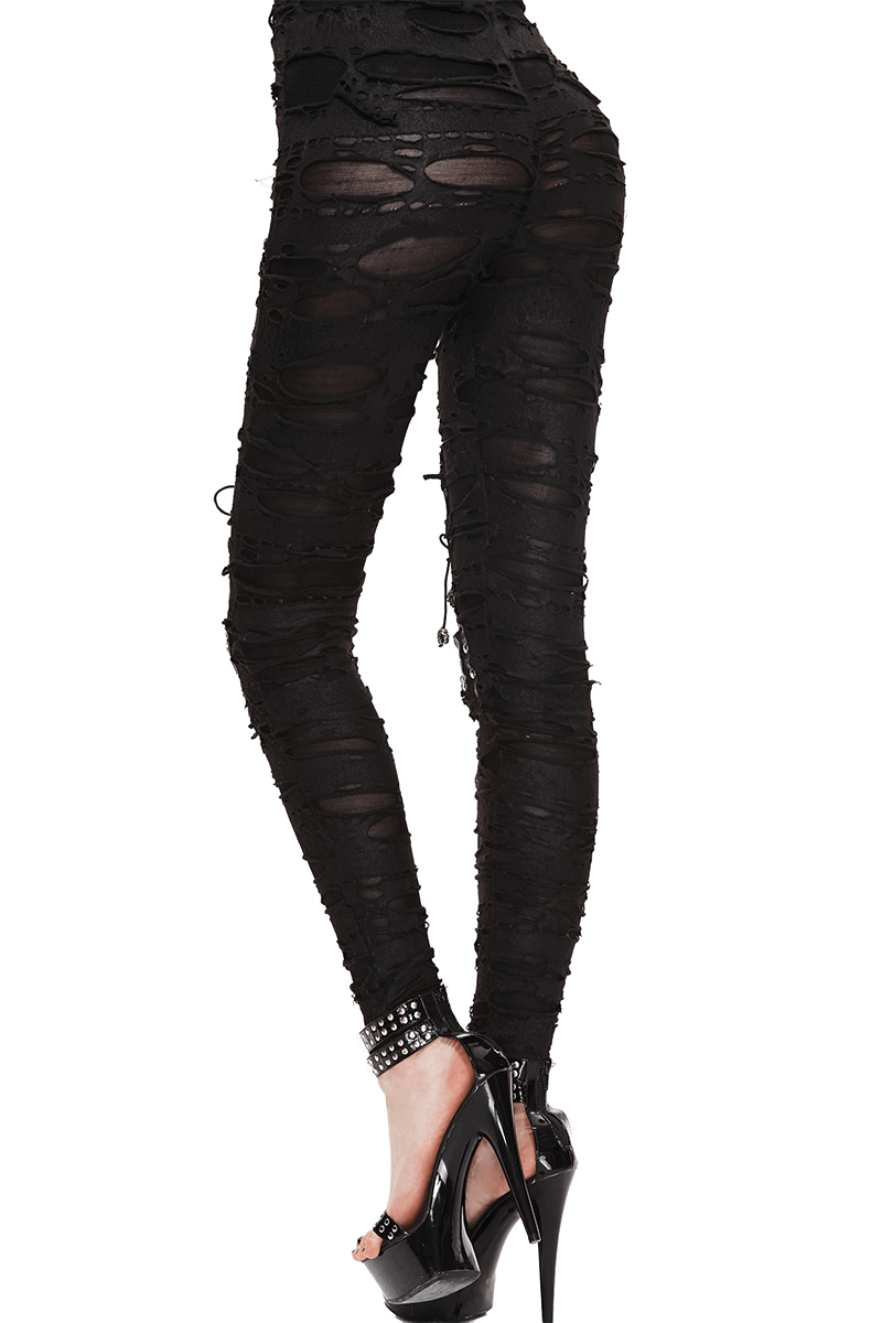 Gothic high waist black pants with torn details, emphasizing a form-fitting silhouette for a stylish, edgy look.