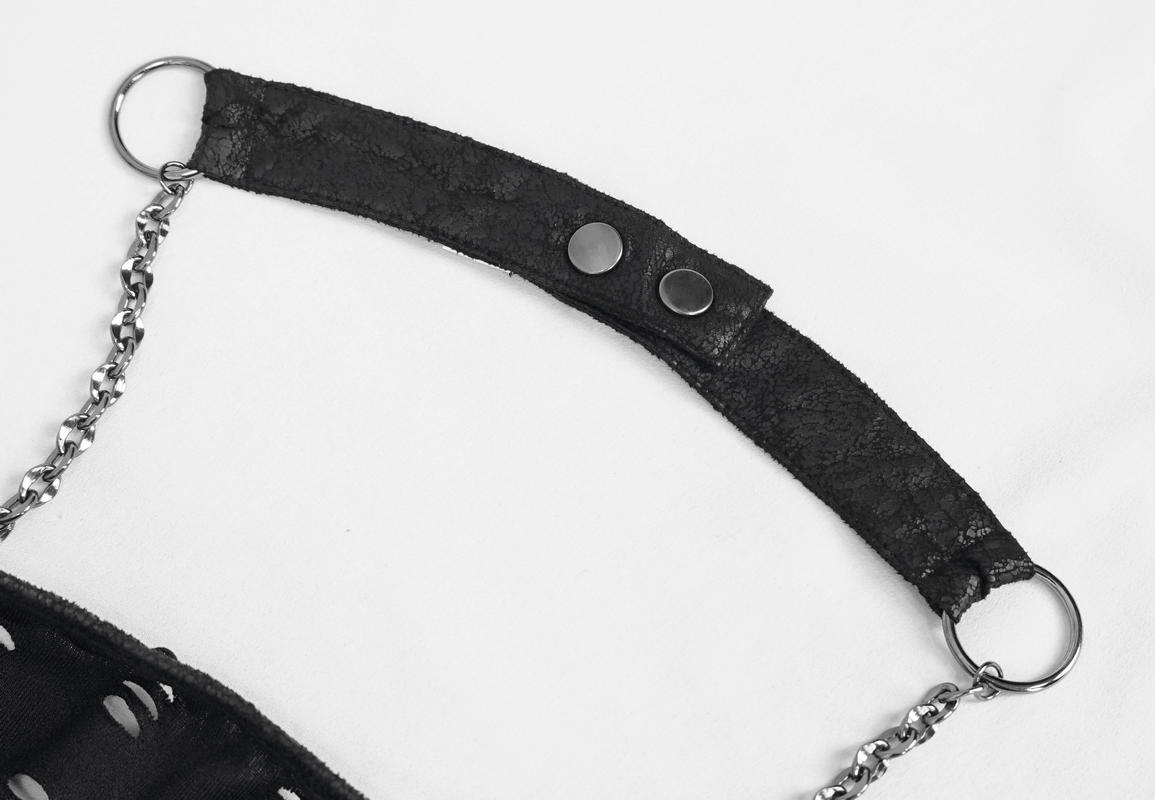 Close-up of the black chain halter strap of a gothic off-the-shoulder top, showcasing edgy design details.