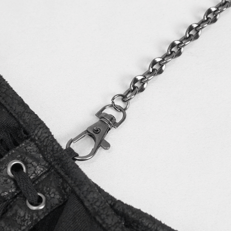 Close-up of black chain and lace-up detail on a gothic off-the-shoulder top.