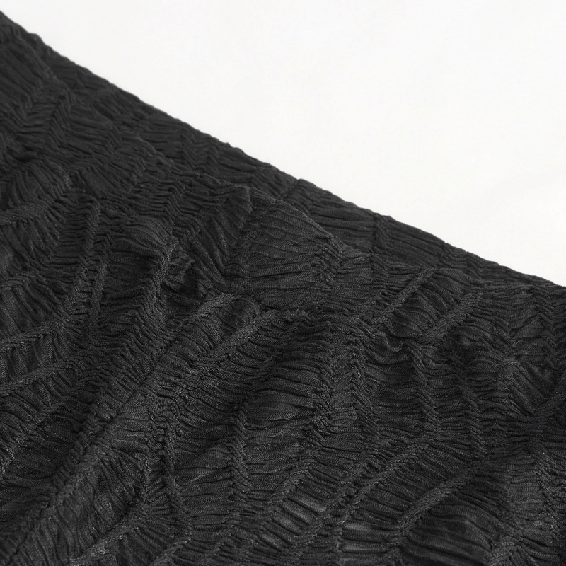 Close-up of textured black fabric with intricate wrinkled design, perfect for gothic-inspired fashion.