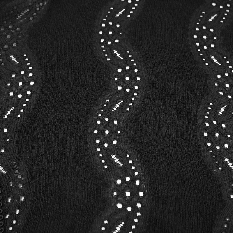 Close-up of black fabric with intricate lace detailing and wave patterns, perfect for gothic fashion styles.