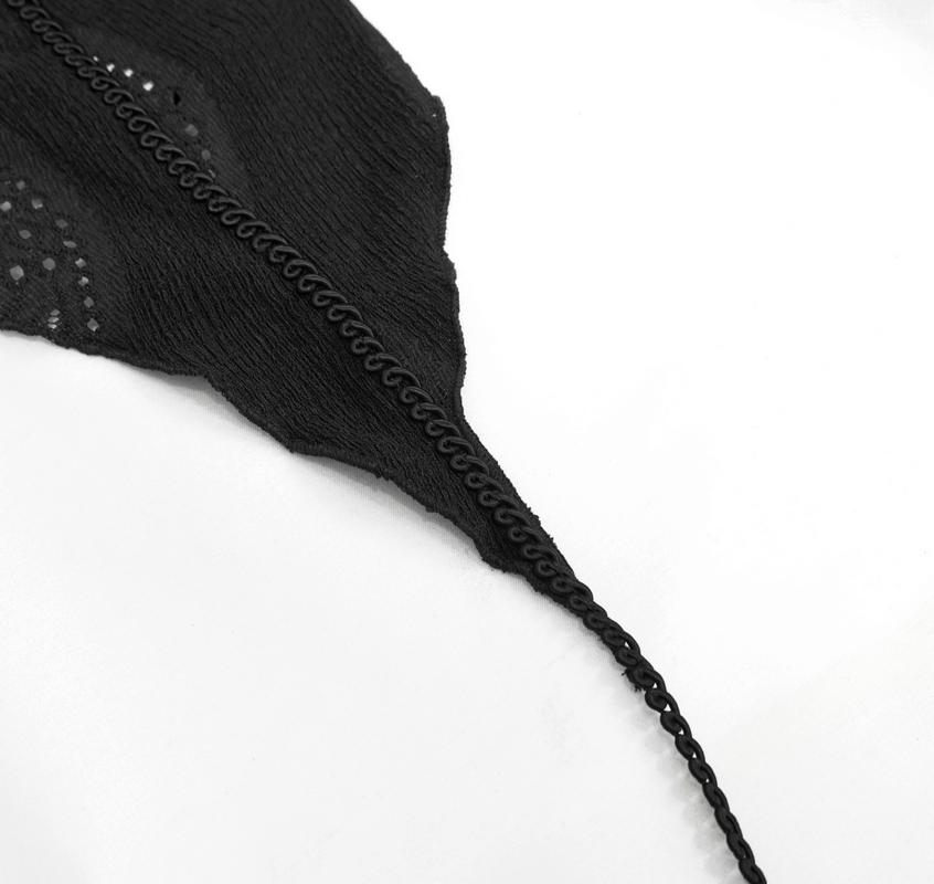 Close-up of the unique lace detailing and drawstring on a gothic black blouse, highlighting its stylish design.