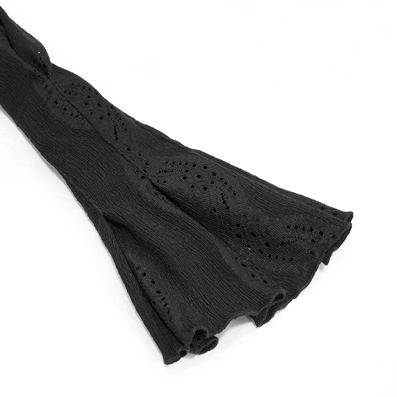 Close-up of a gothic black lantern sleeve blouse showcasing intricate lace patterns and flowing fabric.