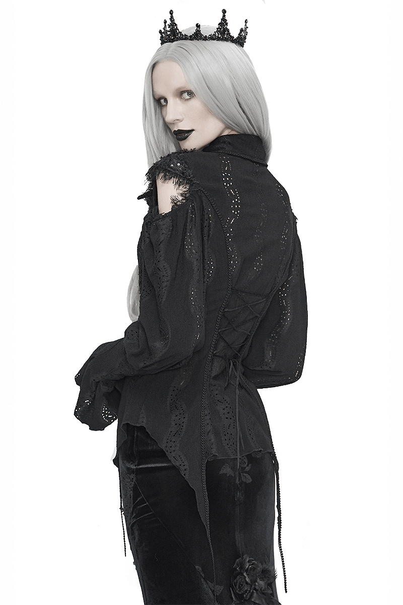 Gothic black blouse with hollowed-out lantern sleeves and lace-up back, worn by model with silver hair and crown.