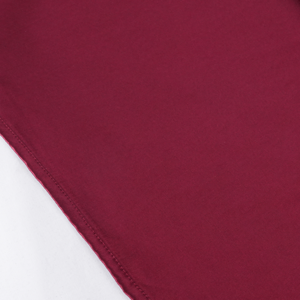 Close-up of burgundy satin fabric showcasing elegant texture and quality, ideal for a Gothic hooded cape.