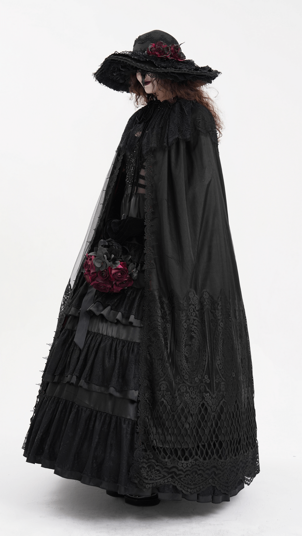 Elegant dark gothic hooded cape with lace embroidery, paired with a dramatic black hat and bouquet of roses.