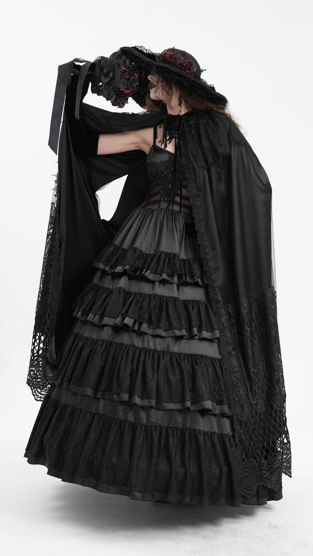 Gothic hooded cape with lace embroidery, worn elegantly over a black layered dress.