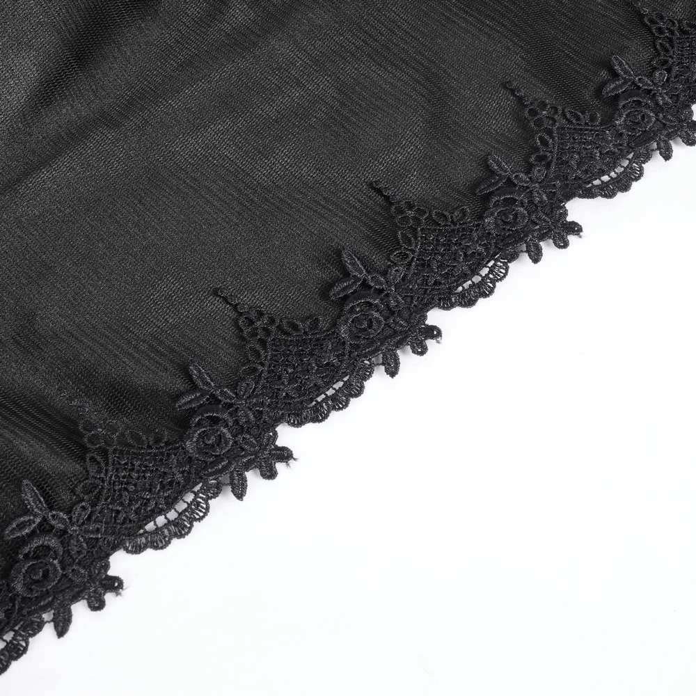 Close-up of dark lace embroidery on a gothic hooded cape, showcasing intricate floral patterns and mesh details.