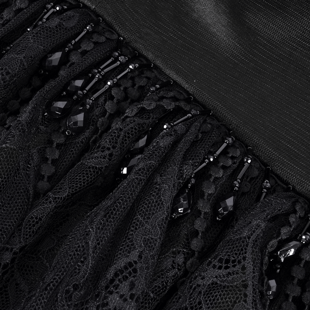 Close-up of intricate black lace with beaded details, perfect for gothic fashion and elegant styling.