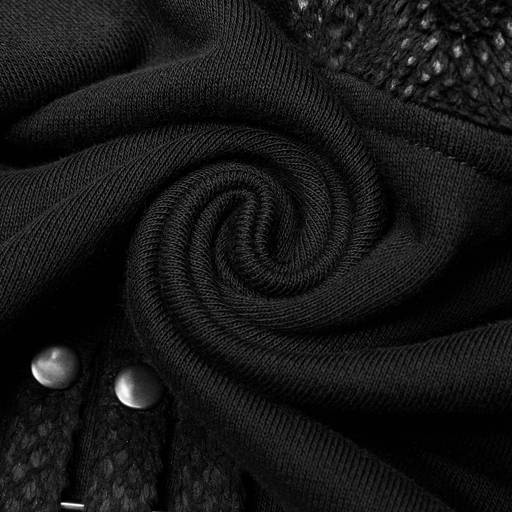 Close-up of warm black knitted fabric showcasing softness and unique texture of a gothic hoodie.