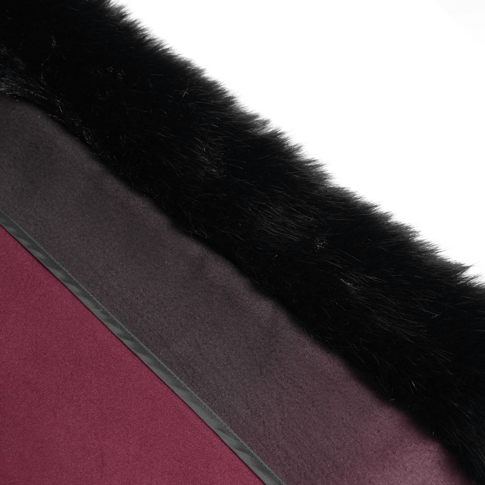 Close-up of black fur trim on gothic hooded cloak with rich ombre red hem and elegant fabric details.