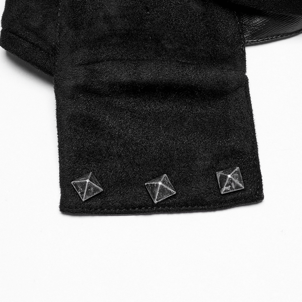 Close-up of gothic hooded cape featuring bold leather strap and pyramid stud details for a punk aesthetic.