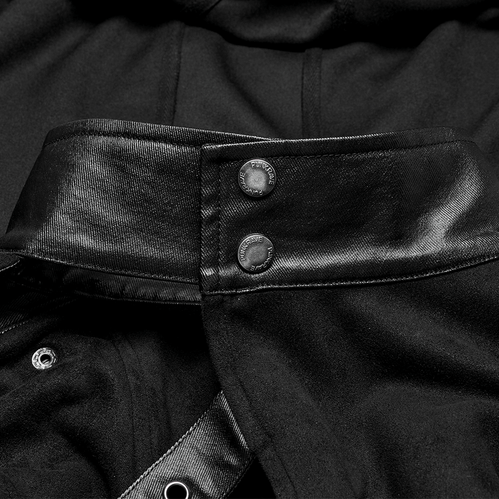 Close-up of the collar and buttons on a gothic hooded half cape with leather strap details.