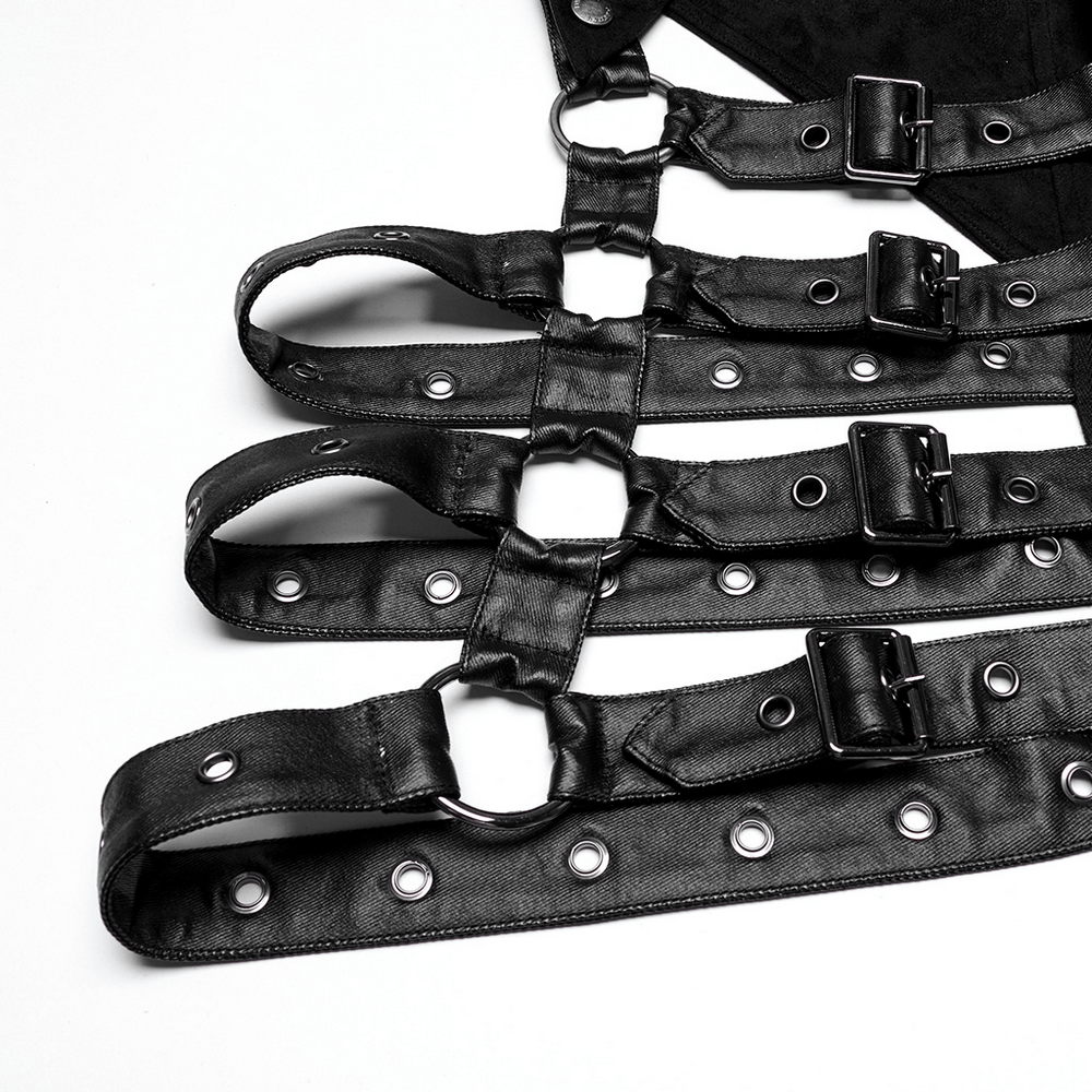 close-up of black leather straps with buckles and grommets from a gothic hooded cape, showcasing punk design details