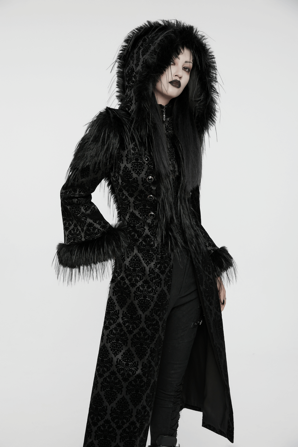 Gothic hooded jacquard coat with faux fur trim and gemstone buttons, exuding elegance and mystery.