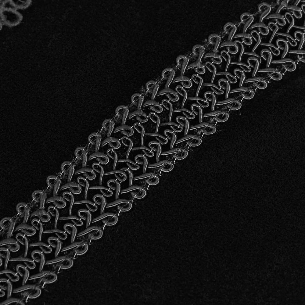 Close-up of intricate lace detail on a black gothic hooded top, showcasing vintage-inspired velvet craftsmanship.