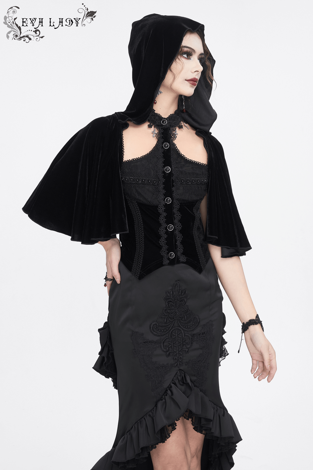 Gothic hooded velvet top with lace details, featuring a dramatic cape and intricate lace-up back. Perfect for dark fashion lovers.
