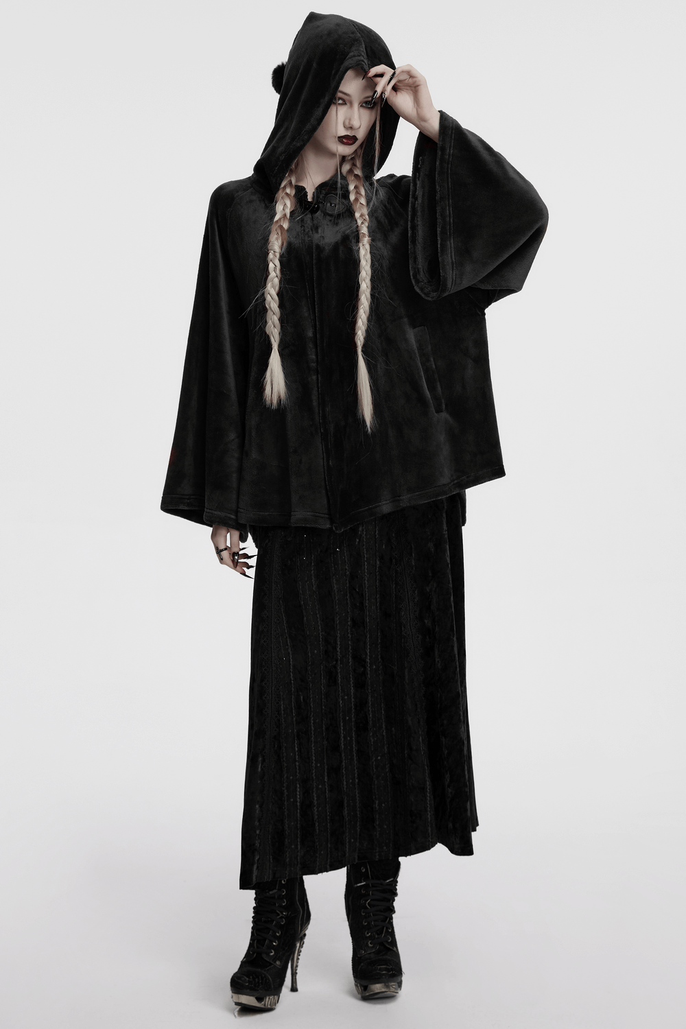 Gothic hooded velvet cape with moon design, perfect for alternative fashion and dark elegance.