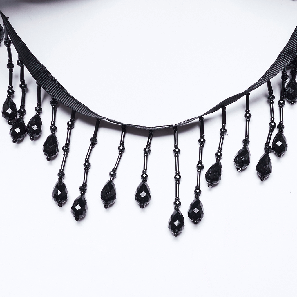 Elegant black bead chain with dangling teardrop crystals for gothic accessories and occult fashion.