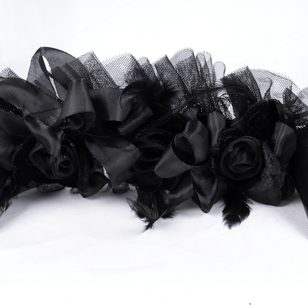 Elegant black floral headband featuring intricate roses and tulle, perfect for gothic or alternative fashion.