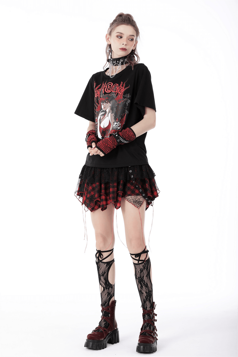 Edgy model in punk rock outfit featuring gothic plaid layered mini skirt, graphic tee, and combat boots.