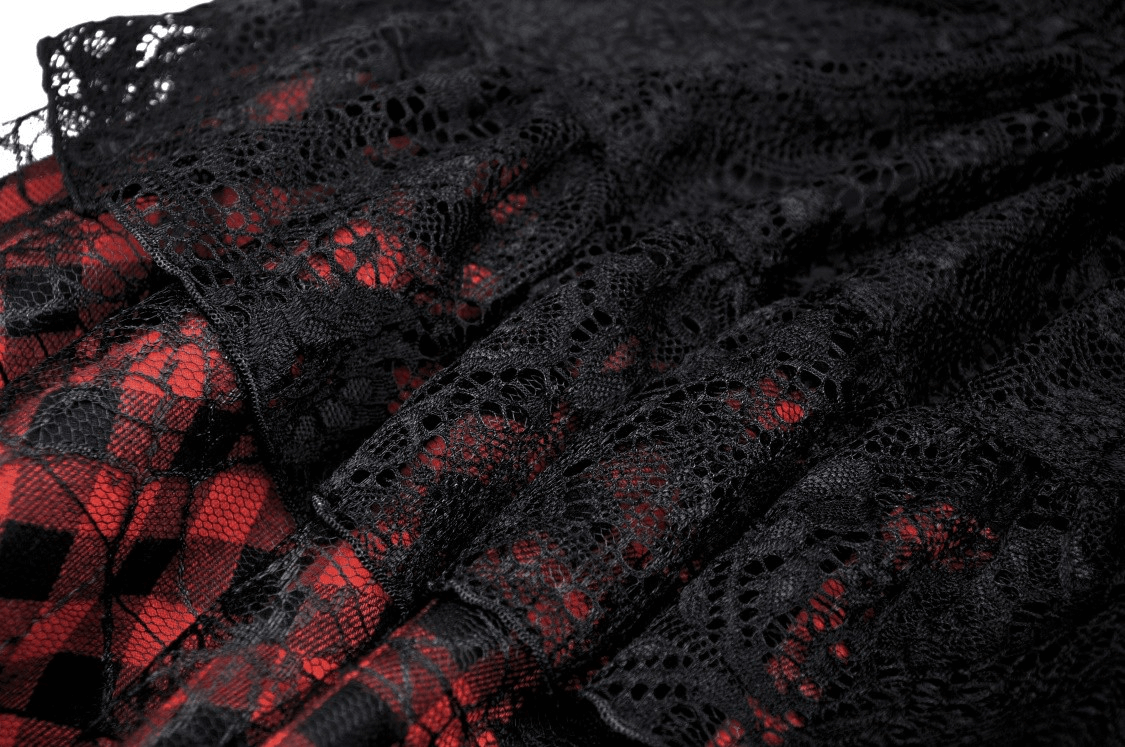 Gothic mini skirt featuring black lace overlay and bold red plaid underlay with tiered design and edgy details.